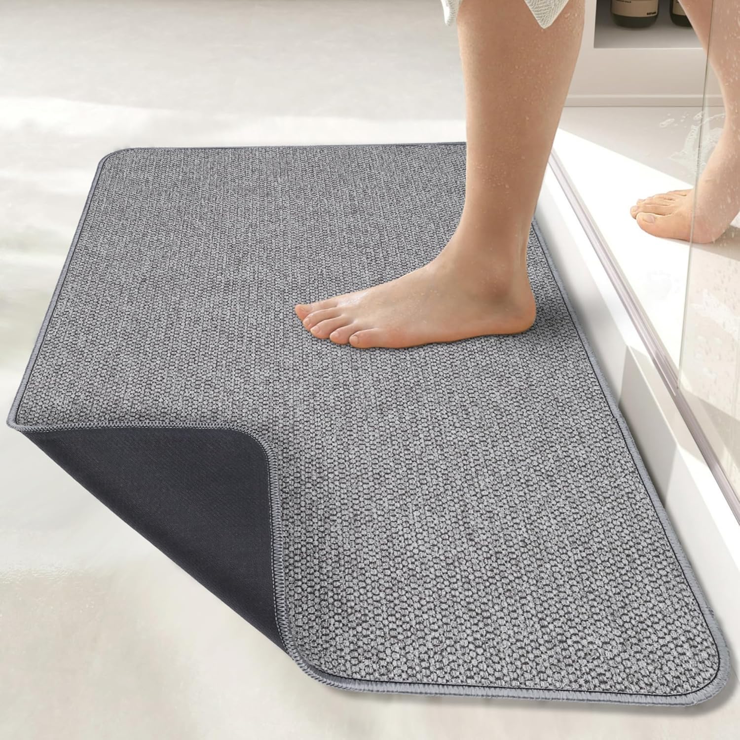Bosap ultra-thin mat fitting perfectly under bathroom door showing 0.2 inch profile