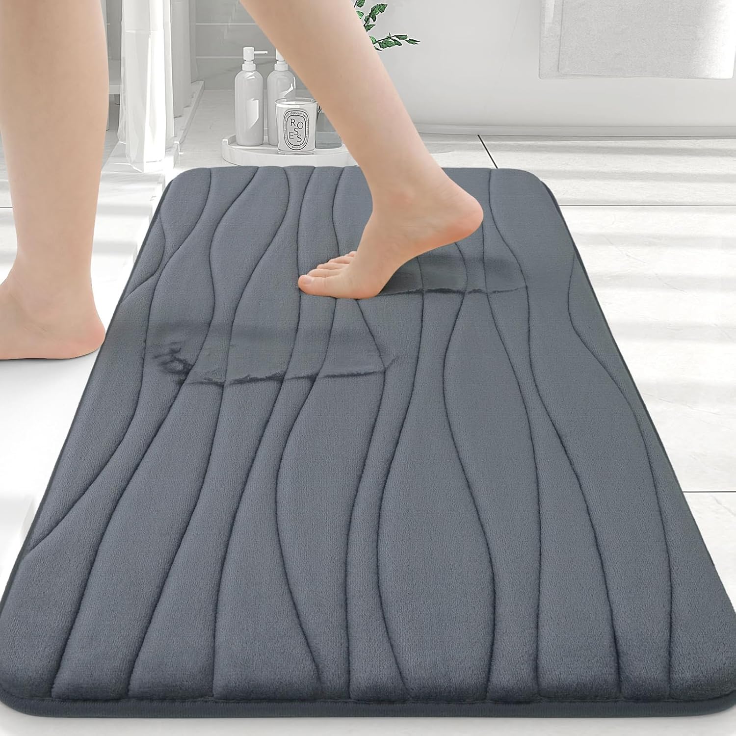 Buganda memory foam bath rug showing foot compression and comfort features